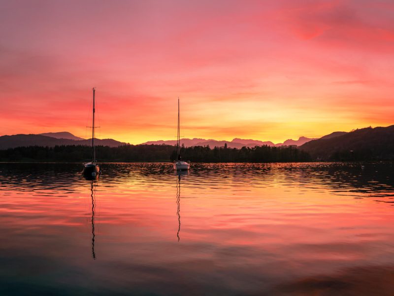 reflections of boats on windermere