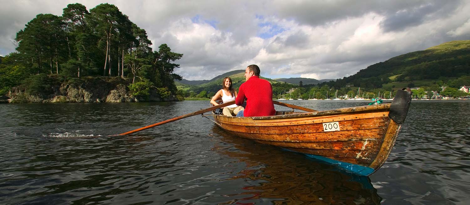 young couple enjoying a leisurely row on windermere